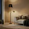 Lindby Stehlampe Efalia, schwarz/gold, Textil, Leselicht