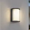 Lindby LED-Außenwandleuchte Calvik, schwarz, geriffelt, IP44