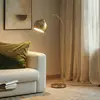 Lindby Bogenstehlampe Moisia, messingfarben, Metall, 148 cm