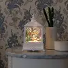 Bild von LED-Wasserlaterne Weihnachtsmann fliegt über Dorf